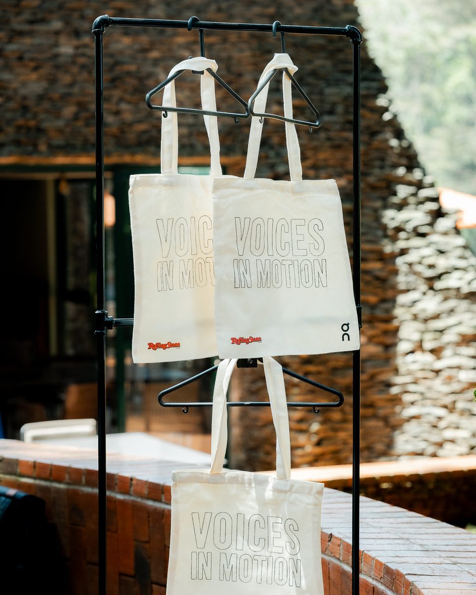 Voices In Motion tote bags on display